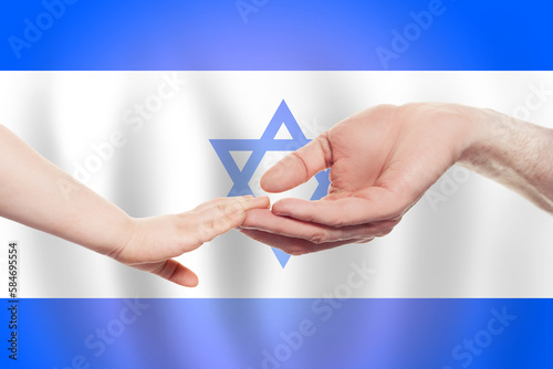 Izraeli baby and parent hands on the background of flag of Izrael Help, aid, support, charity concept
