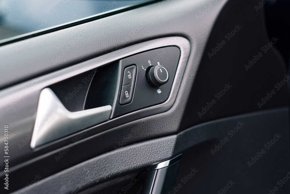 Modern car interior, control details, aluminum, leather steering wheel, Alcantara, car multimedia shown in the car interior.