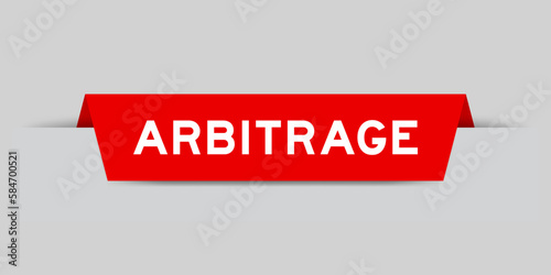 Red color inserted label with word arbitrage on gray background