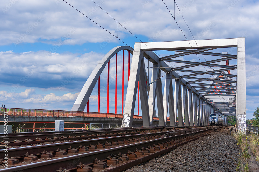 A train drives over the Elbe Bridge in Lutherstadt Wittenberg in Saxony-Anahlt