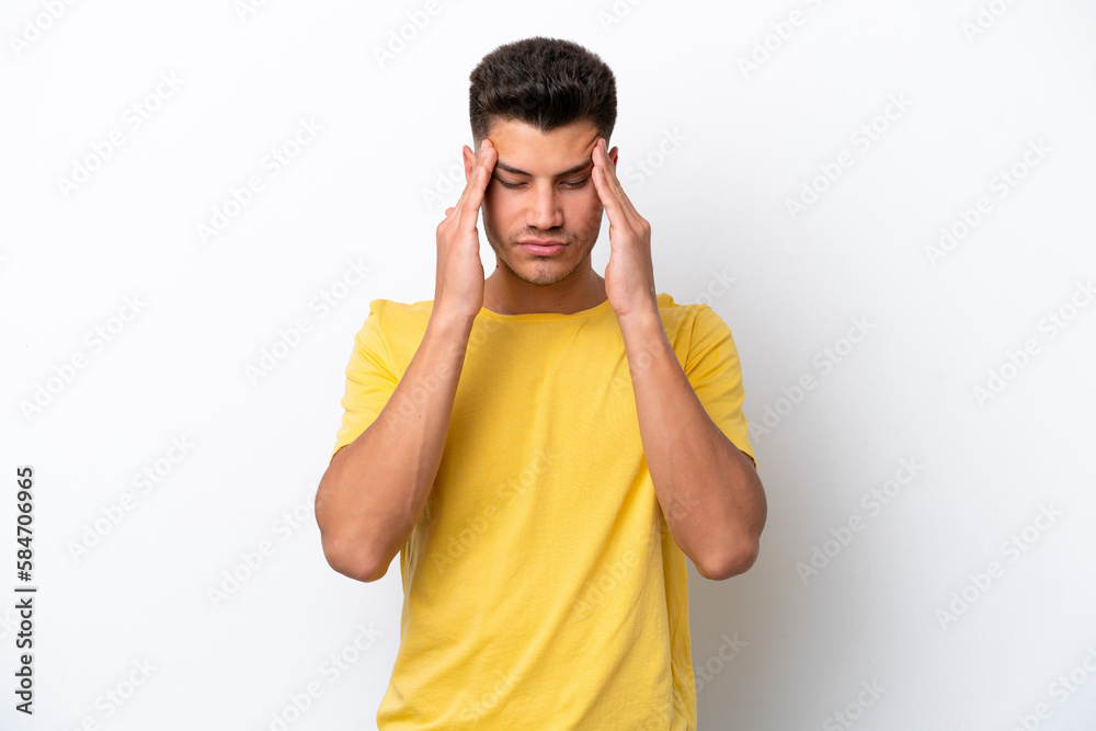 Young caucasian man isolated on white background with headache Young caucasian man isolated on white background with headache