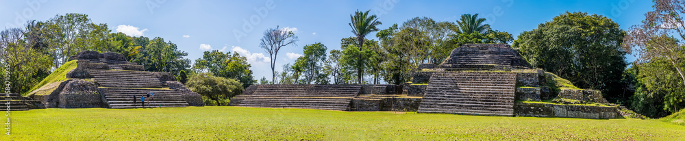 A panorama view across the first plaza in the ancient Mayan city ruins of Altun Ha in Belize on a sunny day