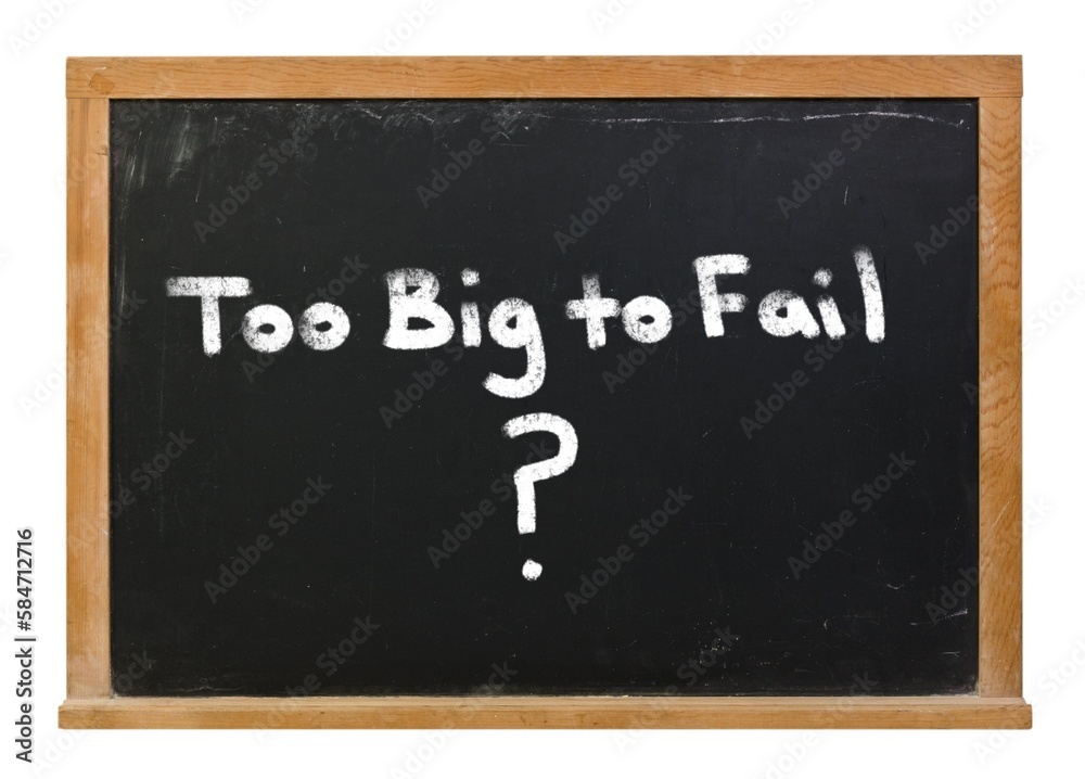 Fototapeta premium Too Big to Fail written in white chalk on a black chalkboard isolated on white