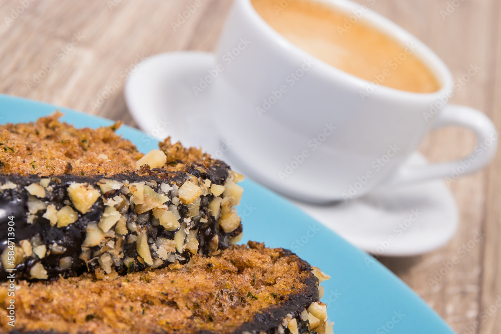 Zucchini dough and cup of white coffee on board. Delicious dessert Zucchini dough and cup of white coffee on board. Delicious dessert