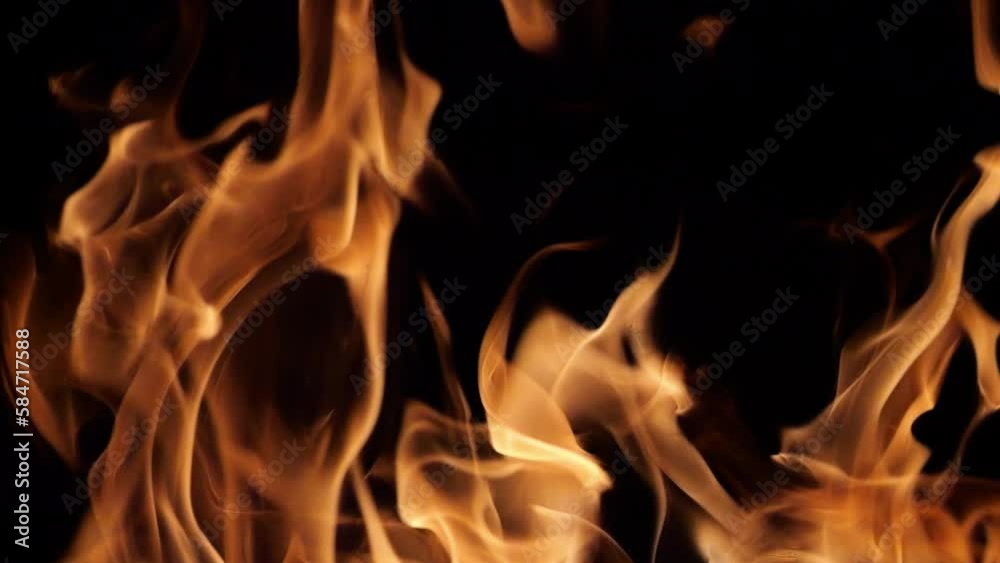 Flames of fire flicker on a black background. Fire hazard. Testura fire. Flames of fire flicker on a black background. Fire hazard. Testura fire.
