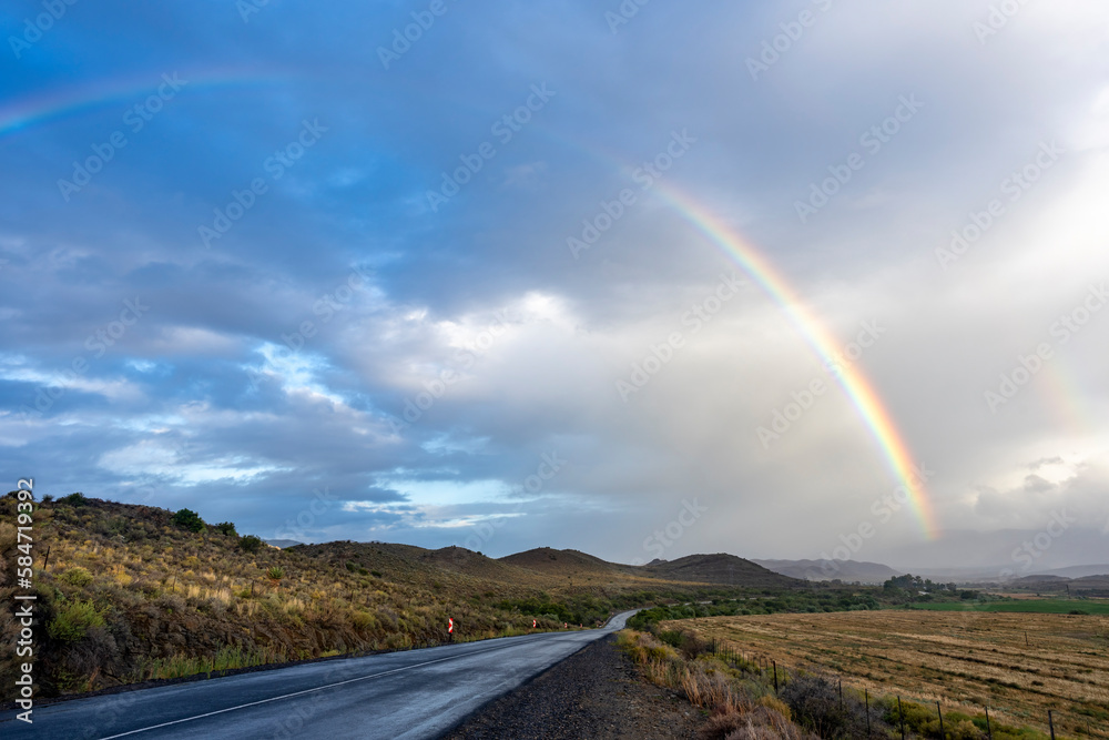 A rainbow after a Karoo storm along the N12 just outside Klaarstroom. Western Cape. South Africa