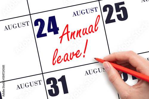 Hand writing the text ANNUAL LEAVE and drawing the sun on the calendar date August 24