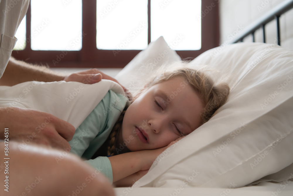 A father enjoys talking with his daughter in his bedroom. before saying goodbye and sending her daughter to bed A father enjoys talking with his daughter in his bedroom. before saying goodbye and sending her daughter to bed