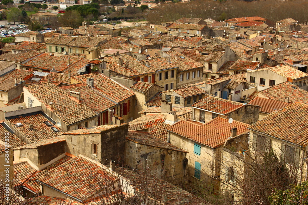 View of the ancient town of  Sommières, Gard, Occitania, France. Top down view of small roman town in South of France with typical Mediterranean terra cotta roofs