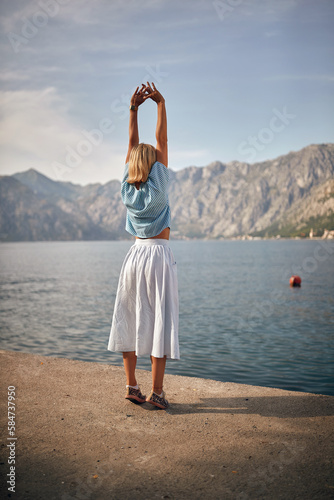 Young girl  enjoys by the lake © luckybusiness