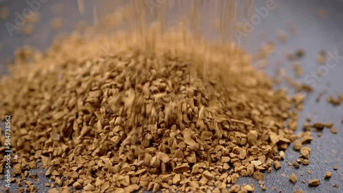 Wallpaper Mural Instant Coffee Granules Fall and Scatter into a Heap on a Black Background. Slow motion. Close up. A stream of brown powder, gold particles, soluble coffee granules flies into a pile. Texture, light. Torontodigital.ca