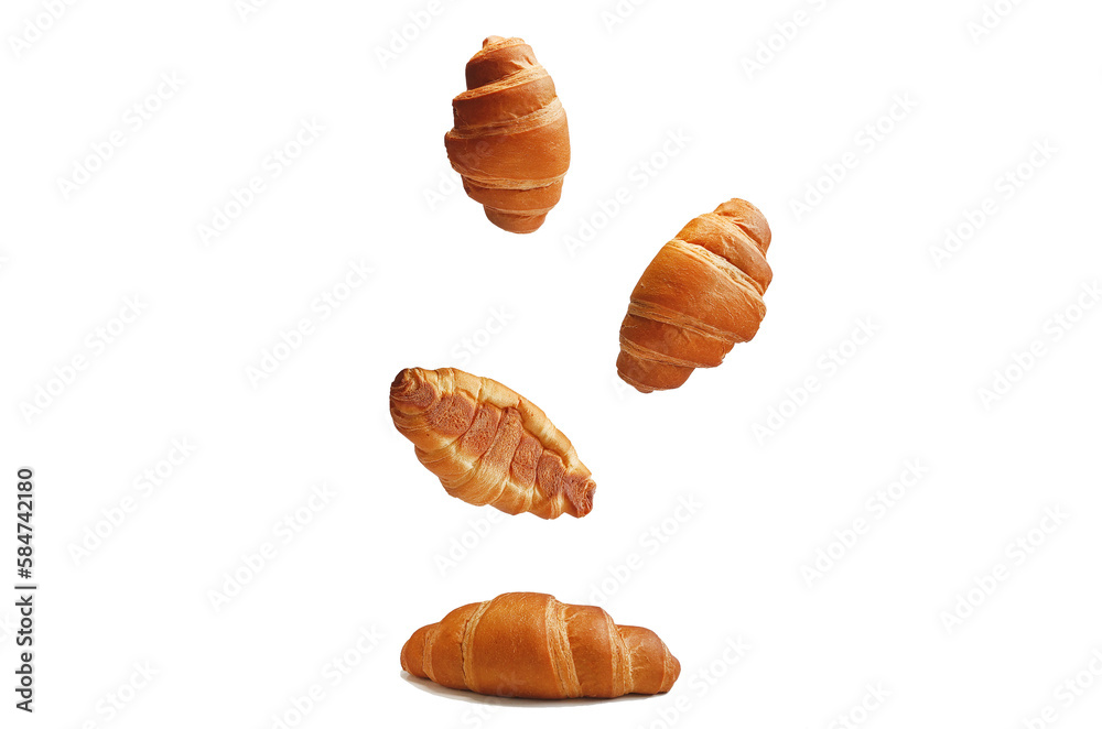 Flying croissants for french breakfast on a white background. Levitating food. Modern food. Design element Flying croissants for french breakfast on a white background. Levitating food. Modern food. Design element