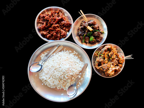 Nepali Newari Khaja Set, Newari special food with Bitten rice, Beef, Peanuts, Buff Choila,beef sukuti.Nepali traditional food. photo