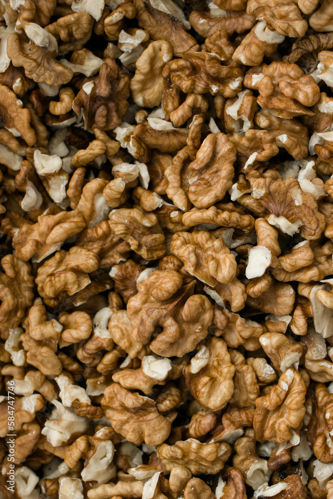 Selective focus. Peeled walnut kernels. Background from walnut kernels. Peeled walnuts.