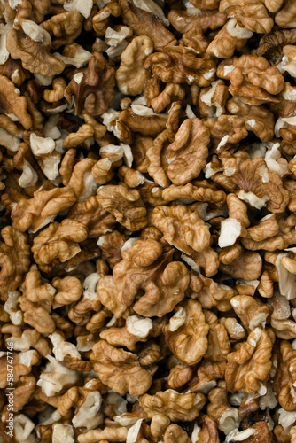 Selective focus. Peeled walnut kernels. Background from walnut kernels. Peeled walnuts.