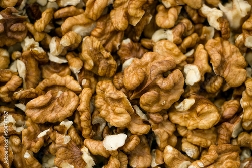 Selective focus. Peeled walnut kernels. Background from walnut kernels. Peeled walnuts.