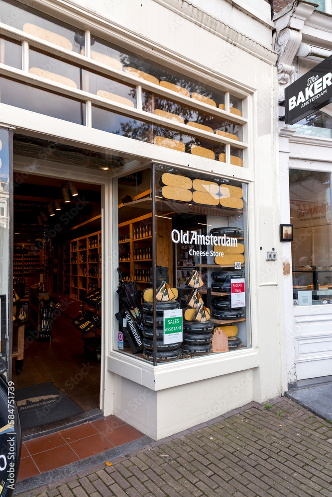 Foto de Different types of Dutch cheese wrapped and stacked in a