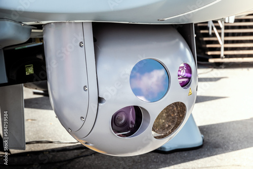 Camera sensor pods under an unmanned aerial surveillance drone aircraft.