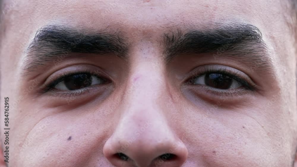 Macro close up of an Arab man face and eyes smiling at camera. extreme person closeup happy expression Macro close up of an Arab man face and eyes smiling at camera. extreme person closeup happy expression