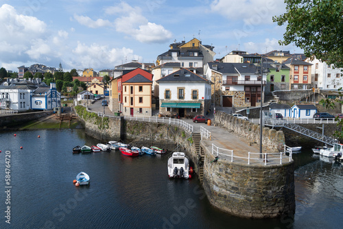 Vista de un típico puerto con barcas en el Cantábrico, localizado en Vega, Asturias, España. photo