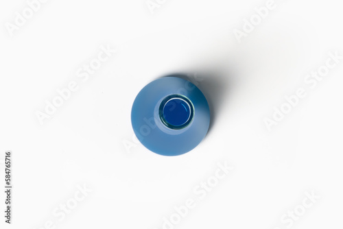 Free Download Laboratory flask with blue, blue liquid. On a white, light background. View from above. - GFXLoad