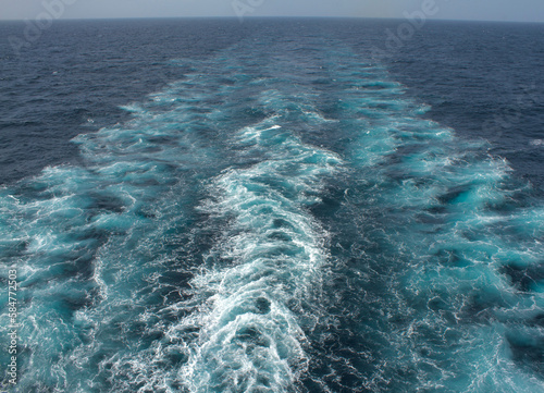 View of the propeller wash of a merchant ship at sea