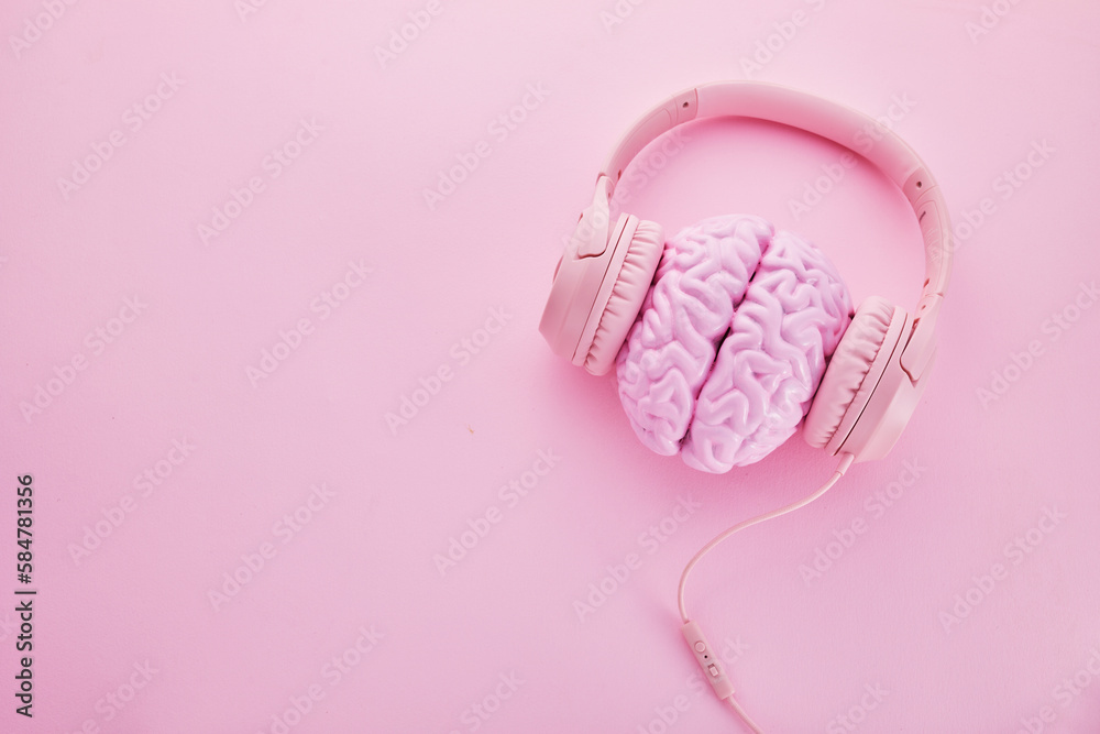 Music brain and musical therapy. Human brain with headphones Music brain and musical therapy. Human brain with headphones
