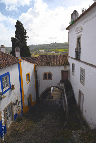 Street with Steps and Arch in an Old Town Óbidos, Portugal
