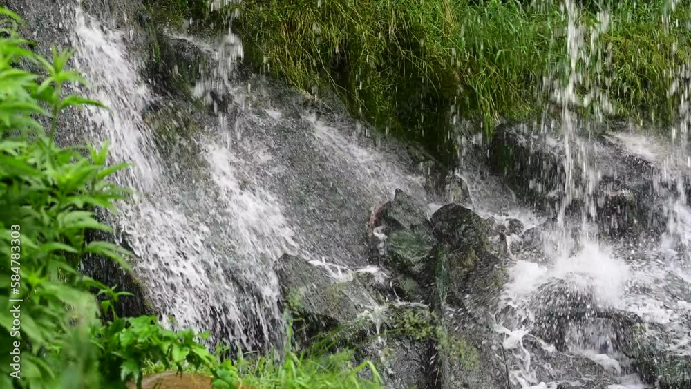 A waterfall on a beautiful midsummer day on the Keila River in Estonia.