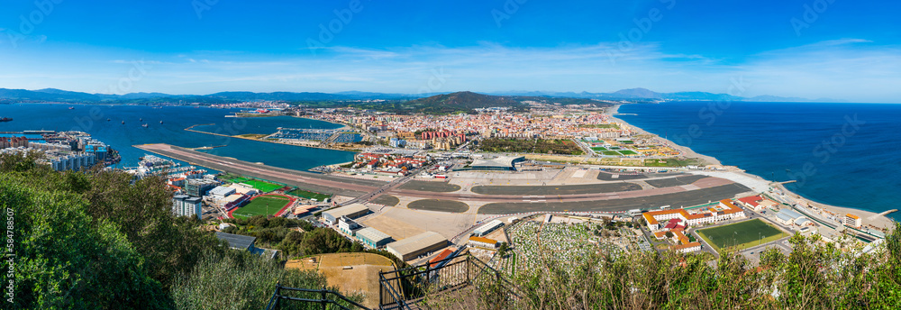 Panoramic  view over Gibraltar - a British Overseas Territory, and Spanish town of La Líinea de la Concepcion on Bay of Gibraltar
