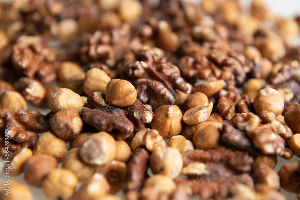 close up on a mix of walnuts close up on a mix of walnuts