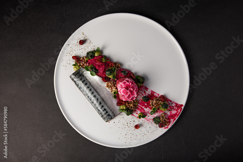 top view on a Gourmet and gastronomic fish dish isolated on a black background,culinary arts