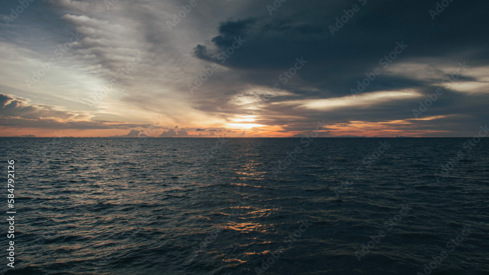 sunset over the sea, Koh Tao, orange skies and dark steel color water, horizontal format sunset over the sea, Koh Tao, orange skies and dark steel color water, horizontal format