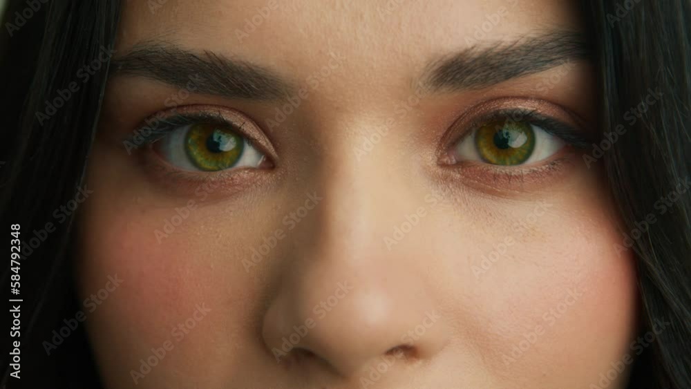 Macro view of young beautiful female with closed eyes opening and looking straight into camera. Calm human background for copy commercial advertisement 4K. Close up eyes of beautiful people concept Macro view of young beautiful female with closed eyes opening and looking straight into camera. Calm human background for copy commercial advertisement 4K. Close up eyes of beautiful people concept