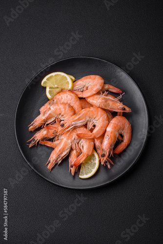 Tableau sur toile Tiger shrimp or langoustine boiled with spices and salt