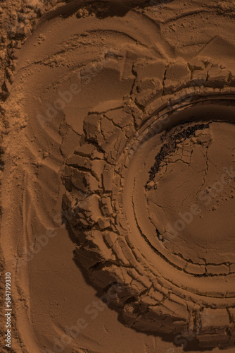 The surface of sand, clay, earth. Wheel dents, tire marks. Craters, depressions, bulges. Mars. Planet