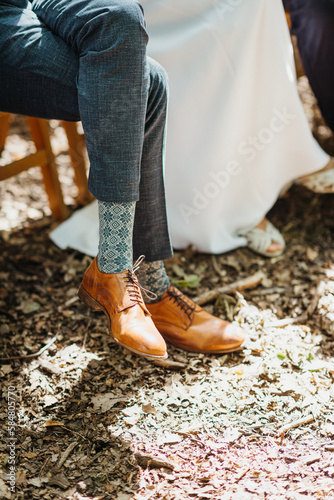 Close up of groom's shoes and funny socks photo