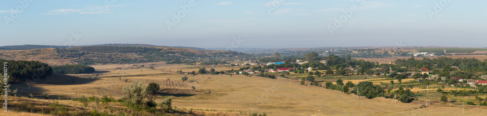 Landscapes of the Northern regions of Moldova. A pastoral panorama with nature. Moldovan villages and houses and streets.