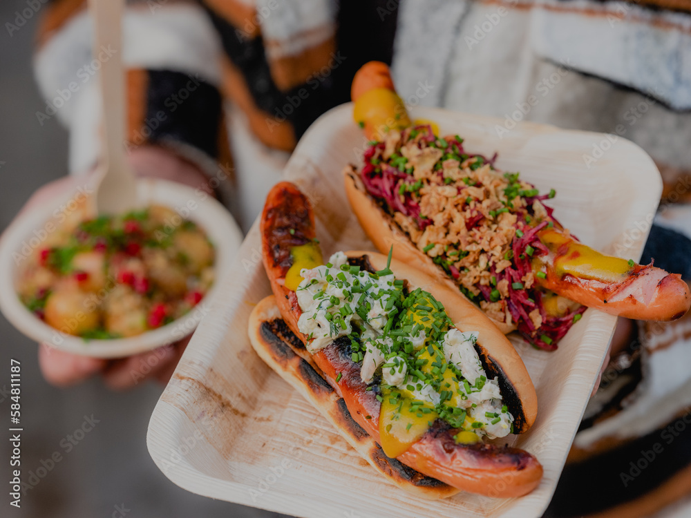 Swedish hot dogs and hasselback potatoes. Stock Photo Adobe Stock