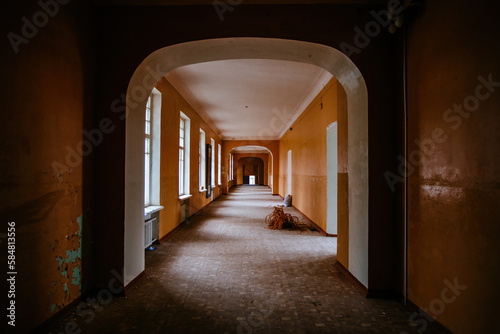 Dark dirty corridor of old abandoned school