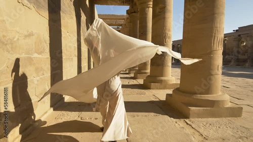 2022 - An interpretive dancer performs among the columns of the Philae Temple Complex in Egypt. photo