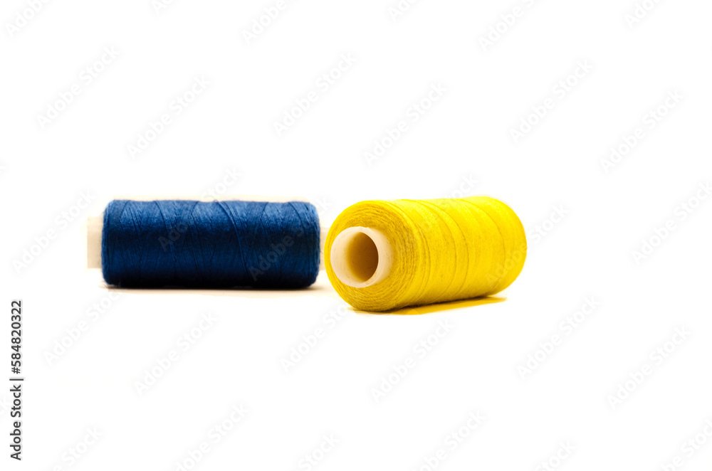 blue and yellow spools of thread on white background. Ukrainian motif blue and yellow spools of thread on white background. Ukrainian motif