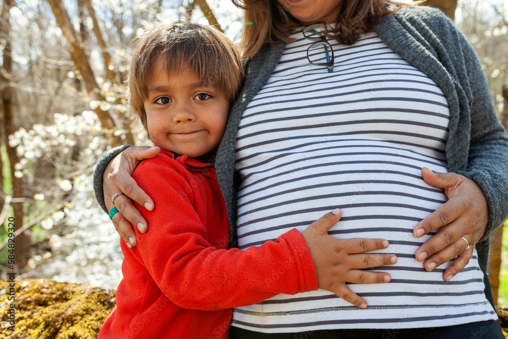 Pregnant Woman With Her Son Outdoor
