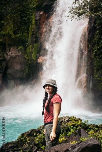 Woman visiting the Rio Celeste waterfall in Costa Rica