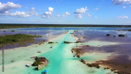Bacalar,Quintana Roo, Mexico-Nov.27th 2017: drone view descent over the canal de los piratas of Bacalar Lagoon of 7 colors with blue turquoise waters, blue sky and white clouds