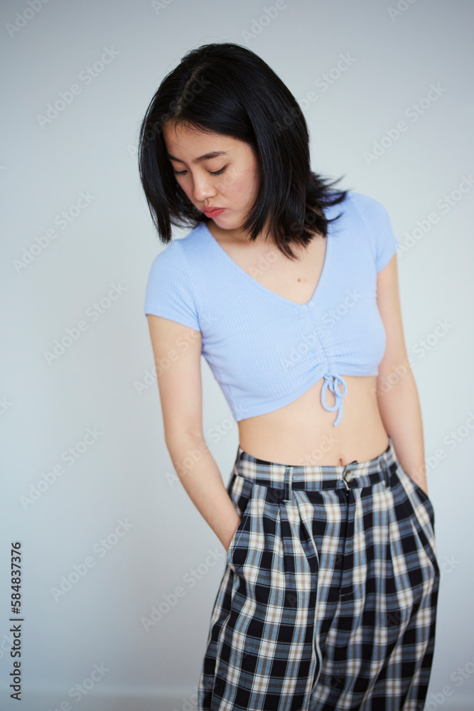 Girl looking at her pyjamas pants.