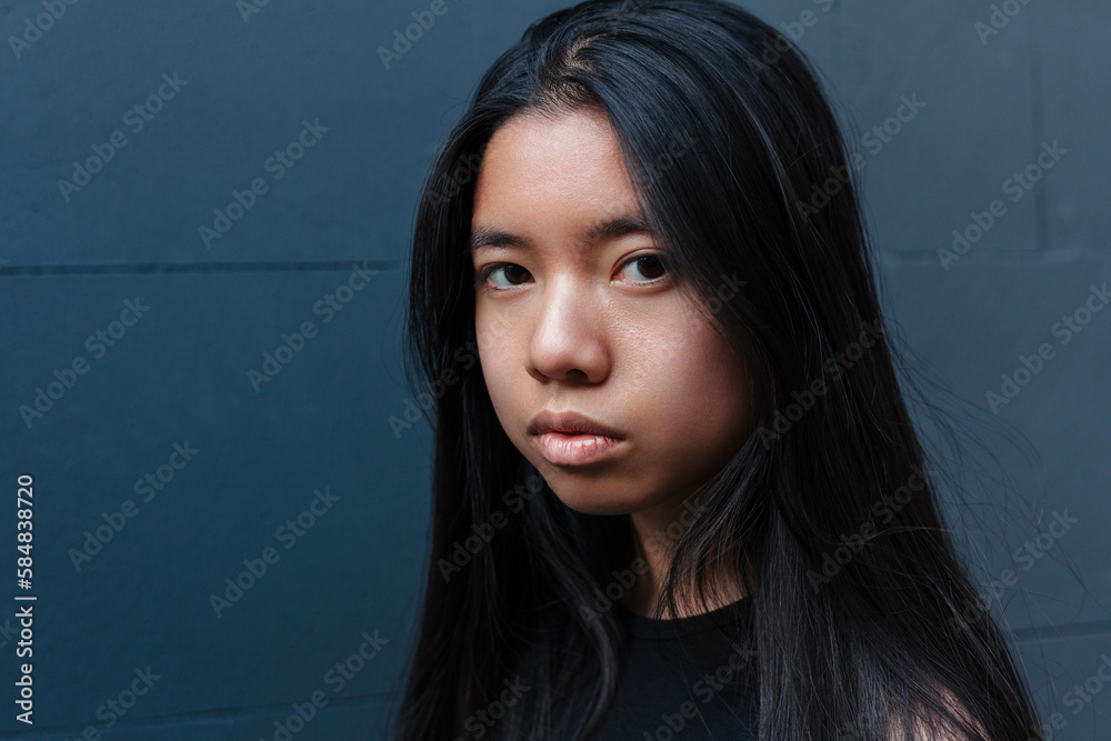 Asian woman looking at camera Asian woman looking at camera