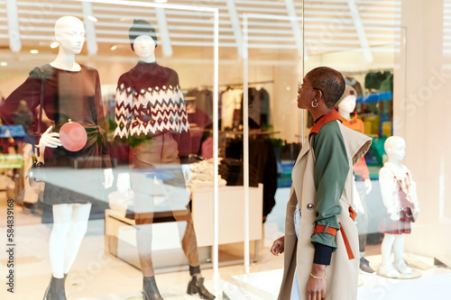 Woman window shopping in a mall