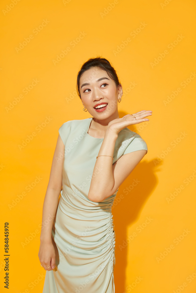 Surprised young woman shouting over yellow background Surprised young woman shouting over yellow background