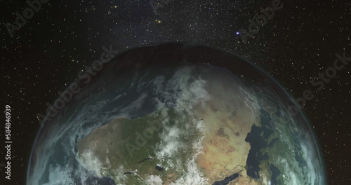 Composition of globe over stars on black background